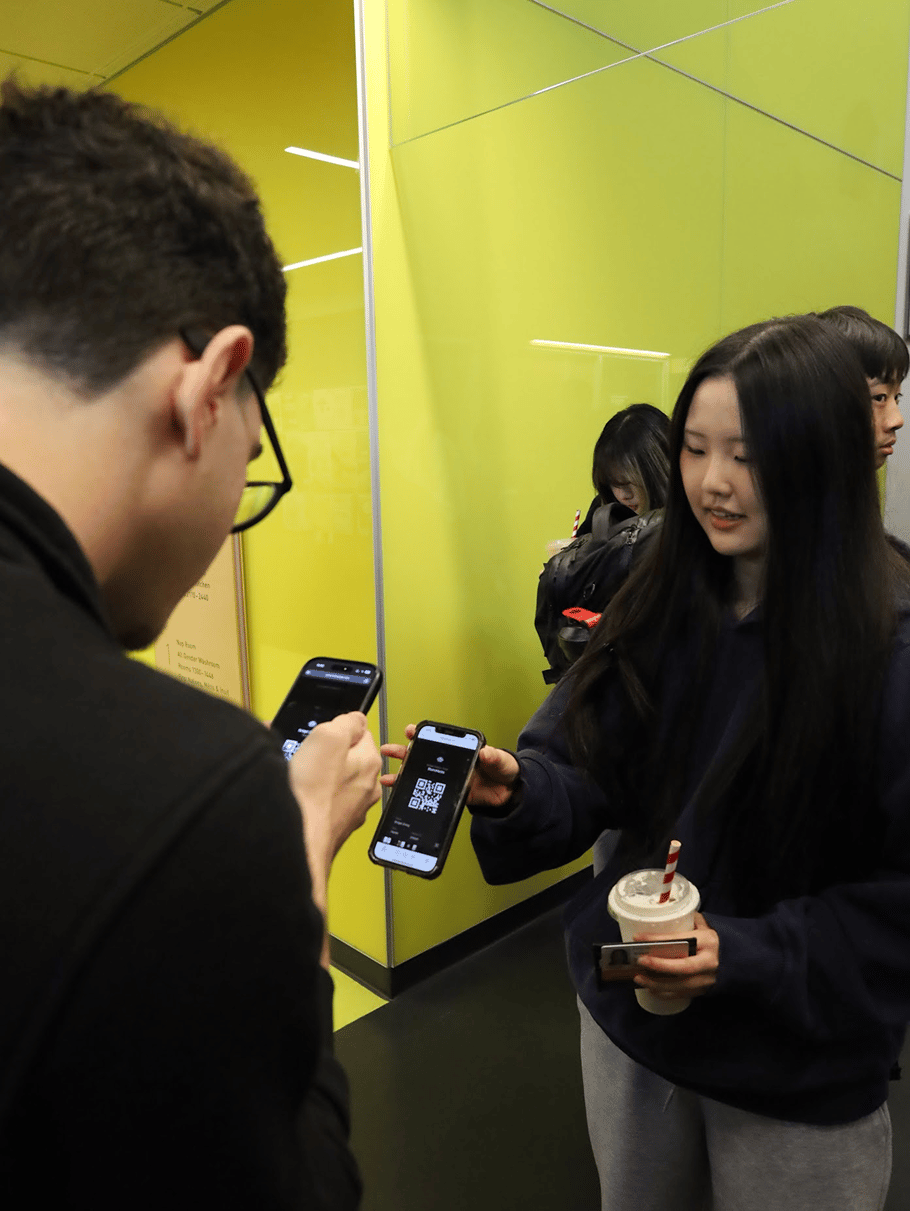 Philip, one of my software engineers, scanning a hacker's QR code during check-in.
